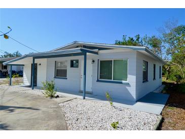 Charming single-story home featuring a fresh exterior paint, a covered entry, and minimal landscaping at 321 40Th Street Nw Ct, Bradenton, FL 34209