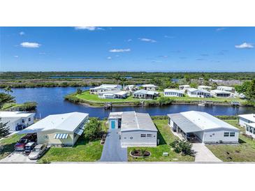 Beautiful aerial view of waterfront homes with docks, offering serene living and access to waterways at 542 Tampico Dr, North Port, FL 34287