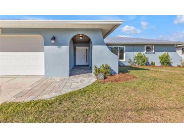 Renovated home exterior featuring a new walkway and landscaping at 4511 Gillen St, Port Charlotte, FL 33948