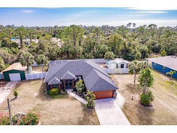 Single-Gathering home with a large backyard and detached structures at 5188 Balmor Ter, North Port, FL 34288