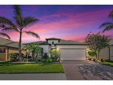 Beautiful home with landscaping, driveway, and two-car garage at 2108 La Palma Ave, Port Charlotte, FL 33953