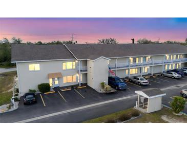 Two-story building with ample parking and a beautiful sunset view at 22278 Vick St # A100, Punta Gorda, FL 33980