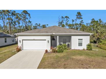 Single-story home with a two-car garage and a screened porch at 18322 Garman Ave, Port Charlotte, FL 33948