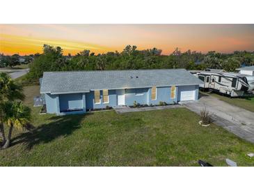 Newly renovated light blue home with a spacious yard at 282 Seminole Nw Blvd, Port Charlotte, FL 33952