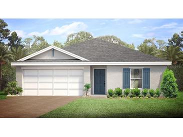 Single story home with two car garage, gray siding, and landscaped lawn at 3332 Jennings Blvd, Port Charlotte, FL 33981