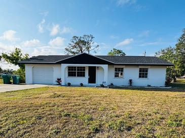 Newly renovated single story home with modern exterior at 1100 Belkton Ave, Port Charlotte, FL 33948