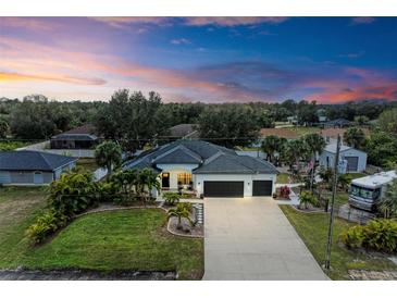 Elevated view of the home, highlighting its size and curb appeal at 1763 Oakland Rd, North Port, FL 34286