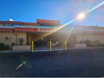 Chelsea House condo building exterior with entrance and parking at 2290 Aaron St # 302, Port Charlotte, FL 33952