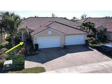 Two-car garage, double-wide driveway, and nicely landscaped front yard at 317 Monaco Dr # 7, Punta Gorda, FL 33950