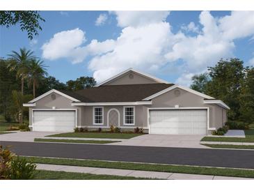 Two-car garage, light taupe exterior, and a brown roof at 9374 Sunbeam Cir, Punta Gorda, FL 33950