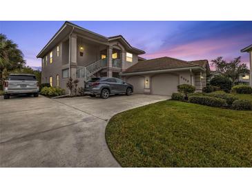 Attractive two-story home with attached garage and manicured lawn at 3112 Club Dr # 124, Port Charlotte, FL 33953