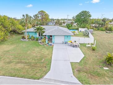 Single-story home with a pool, boat, and spacious yard at 1638 Viscaya Dr, Port Charlotte, FL 33952