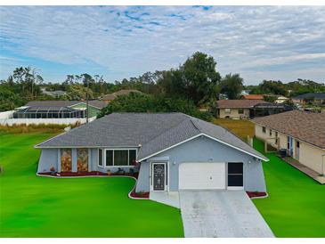 Charming one-story home with a well-maintained lawn and inviting curb appeal at 2798 Rock Creek Dr, Port Charlotte, FL 33948