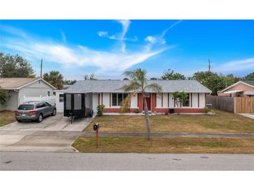 Brick ranch home with carport and mature landscaping at 4657 Nele St, North Port, FL 34287