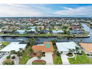 Aerial view of waterfront home with pool and canal access at 820 Via Tunis, Punta Gorda, FL 33950