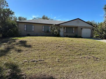 Ranch-style home with a large yard at 3271 Eldorado Ln, Port Charlotte, FL 33948