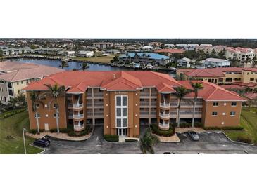 Aerial view of La Rosanna, a condo building with a pool and waterfront access at 3322 Purple Martin Dr # 126, Punta Gorda, FL 33950