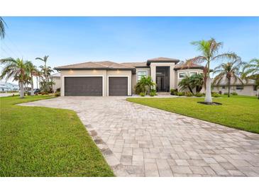 Luxury home with two-car garage and paver driveway at 1099 Cimarron Dr, Punta Gorda, FL 33950