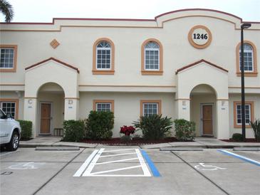 Front view of a two-story building with multiple units and parking at 1246 Rio De Janeiro Ave # 503, Punta Gorda, FL 33983