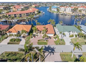 Luxury waterfront home with private driveway and canal views in a prestigious community at 1460 Raven Ct, Punta Gorda, FL 33950