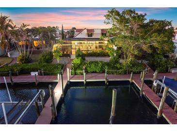 Aerial view of waterfront home with private docks and boat slips at 25188 Marion Ave # 12, Punta Gorda, FL 33950