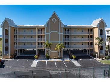 Three-story building with parking and landscaping at 101 N Marion Ct # 131, Punta Gorda, FL 33950