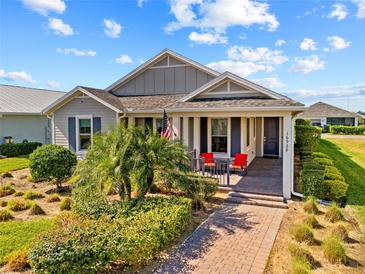 Beautiful craftsman style home with covered porch and landscaped yard at 16928 Curry Preserve Dr, Punta Gorda, FL 33982