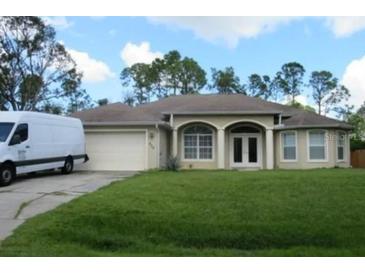 One-story house with attached garage and manicured lawn at 4320 Amanda Ave, North Port, FL 34286