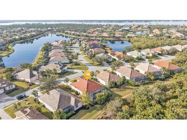 Aerial view of single-Gathering home in a waterfront community at 13298 Scrub Jay Ct, Port Charlotte, FL 33953