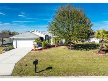 Single-story home with a well-maintained lawn and driveway at 42 Santarem Cir, Punta Gorda, FL 33983