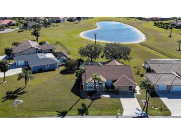 Aerial view of single-Gathering home with pool and heart-shaped lake nearby at 7352 Parkinsonia, Punta Gorda, FL 33955