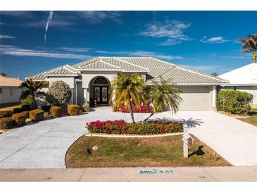 Beautiful single-story home with landscaped yard and driveway at 1014 Francesca Ct, Punta Gorda, FL 33950