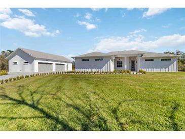 Beautiful home featuring a spacious lawn, two-car garage, and neutral color palette at 2154 Azure Rd, North Port, FL 34286