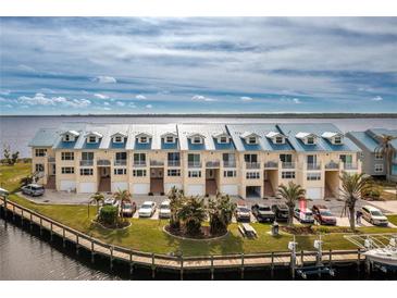Aerial view of waterfront townhouses with parking and boat slips at 4410 Warren Ave # 504, Port Charlotte, FL 33953
