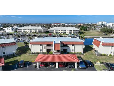 Aerial view of waterfront condo community with boat slips and parking at 311 Garvin St # 207B, Punta Gorda, FL 33950