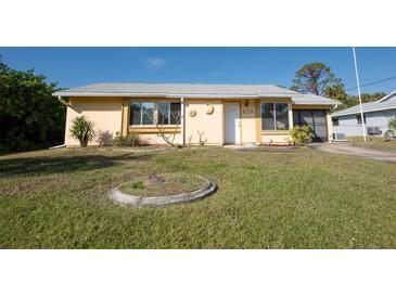 Charming single-story home featuring a well-maintained front lawn and cozy curb appeal at 4355 Boggs St, Port Charlotte, FL 33948