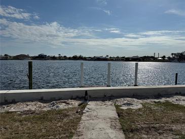 Beautiful waterfront home with a private pier for boating and easy access to the open waters at 21535 Edgewater Dr, Port Charlotte, FL 33952