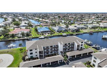 Waterfront condo complex with boat docks, covered parking, and beautiful canal views at 367 Coldeway Dr # H10, Punta Gorda, FL 33950