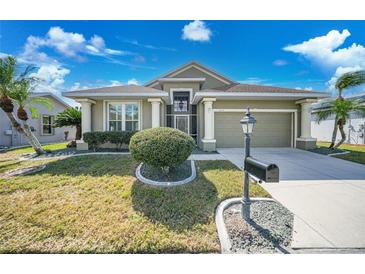 Charming single-story home with well-manicured lawn, attractive landscaping, and inviting curb appeal at 1673 Palace Ct, Port Charlotte, FL 33980