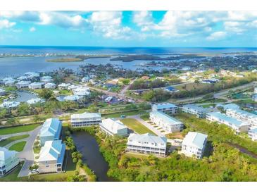 Beautiful aerial view of coastal community showcasing waterfront property and scenic landscape at 10300 Coral Landings Ct # 93, Placida, FL 33946