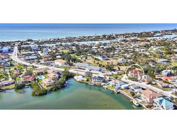 Aerial view of waterfront home; close to beach and marina at 710 Albee W Rd, Nokomis, FL 34275