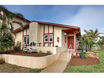 Inviting exterior with landscaping and charming architectural details at 93 Boundary Blvd # 301, Rotonda West, FL 33947