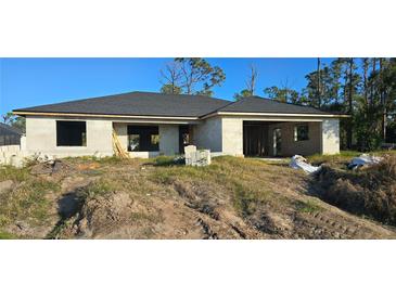 Newly constructed one-story home with a grey roof and block exterior at 5306 Jennings Blvd, Port Charlotte, FL 33981
