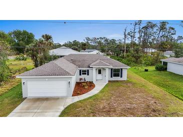 Newly constructed home with a two-car garage and landscaped front yard at 5400 Jennings Blvd, Port Charlotte, FL 33981