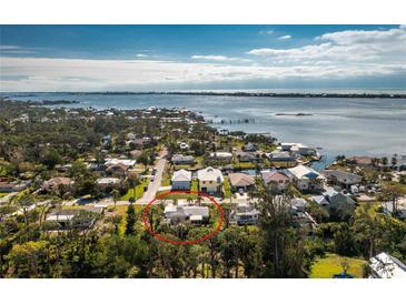 Aerial view of a house near the water at 810 Harvard St, Englewood, FL 34223