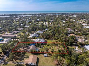 Aerial view showing home's large lot and location at 1651 Maria St, Englewood, FL 34223