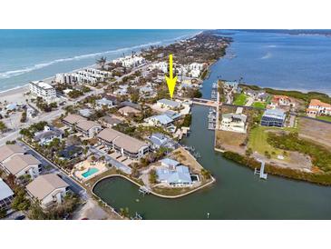 An aerial view showcasing the property's waterfront location and surrounding neighborhood at 2805 N Beach Rd # B, Englewood, FL 34223