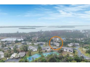 Aerial view showing the property and surrounding tennis courts at 4260 Placida Rd # 18C, Englewood, FL 34224