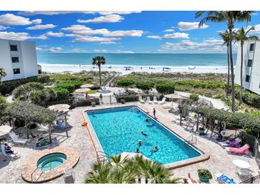 Aerial view of resort-style pool, spa, and beach access at 5700 Gulf Shores Dr # B234, Boca Grande, FL 33921