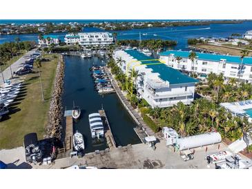 Luxury waterfront condo with private boat slip and community pool at 8226 Harborside Cir, Englewood, FL 34224
